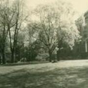 Front of Dixon Hall with lawn and trees