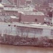 Campus from river with tugboat (1970s?)