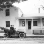 Mr. and Mrs. L.V. Kupper in front of home