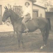 Carrie Goodell riding horse, ca. 1920