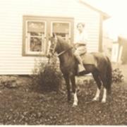 Carrie Goodell on horse, ca. 1920